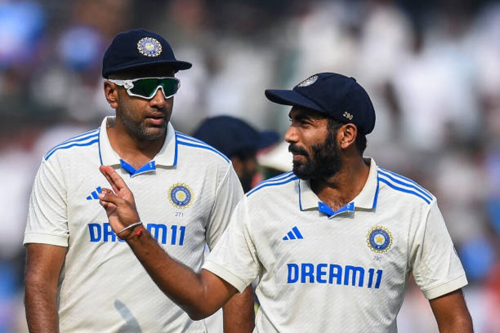 Jasprit Bumrah talks with Ravichandran Ashwin after England's first innings in Hyderabad on January 25, 2024. (Photo by Noah Seelam/AFP via Getty Images)